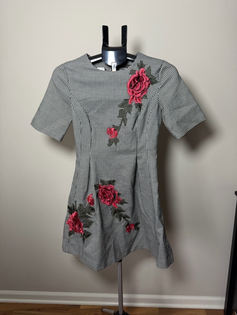 Reserved Black-and-White Checked Mini Dress with Pink Floral Appliqués